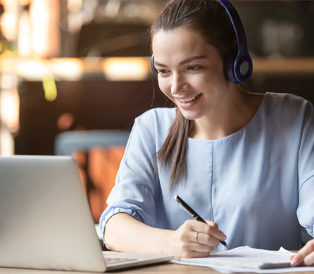 girl studying on test subjects with laptop